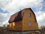 Дом из бруса с ломанной крышей. Место строительства Новгородская область.
